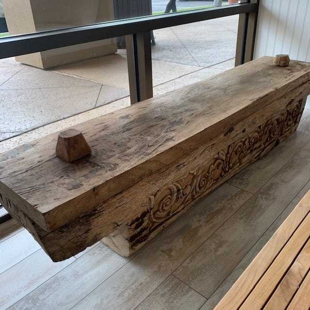 Beautiful hand-carved antique teak bench.  Interior has a carved out hidden storage space.  Beautiful carving on side of the bench.  Great patina.  One-of-a-kind piece.  Stunning.