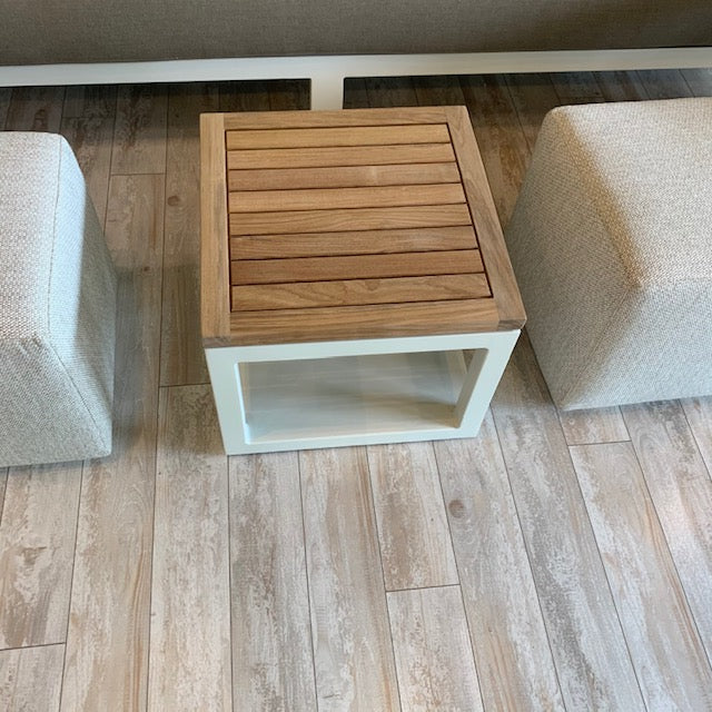 The terrace side table has a powder-coated aluminum frame and a teak top.  Beautiful and extremely durable, the terrace table is perfect for the lanai.  18